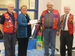 Wendy Pietrus presents Santas Anonymous with a cheque for $2048.80, that was raised at this year’s Festival of Trees. From left: Steve Gnida, Wendy Pietrus, George Matechuk, and Cliff Rolheiser.