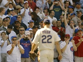 Chicago Cubs' starting pitcher Mark Prior gets a standing ovation from the crowd as he leave the field after six scoreless innings against Pittsburgh at Wrigley Field in Chicago in this 2004 file photo.