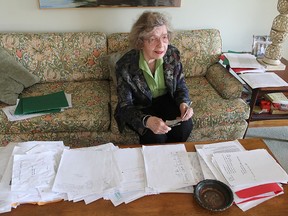 Margaret Baird sits in her Calvin Park home's living room, surrounded by her research as she takes on the telecommunications industry to protest a planned cell tower in her neighbourhood.
Michael Lea The Whig-Standard