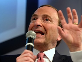 NHL Commissioner Gary Bettman gestures during a news conference in Toronto November 26, 2013. (REUTERS/Aaron Harris)