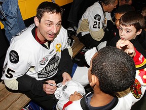 Former Belleville Bulls star Brent Gretzky signs autographs for young fans during an NHL Alumni Game in Belleville in 2011. Gretzky, 41, is scheduled to return Friday as the NHL Alumni Team takes on the local Law Enforcement All-Stars in a Special Olympics Torch Run fundraiser at Yardmen Arena. (Intelligencer file photo by JEROME LESSARD)