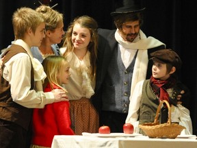 Actors Nick Ormerod (left), Dorothy Downs (Mrs. Cratchit), Taylor Nolan, Ellena Grant, Thomas Fox (Mr Cratchit) and Tiny Tim, Booth Moyle-Dudzic, rehearse a scene from A Christmas Carol at The Palace Theatre. (Photo courtesy of Ross Davidson).