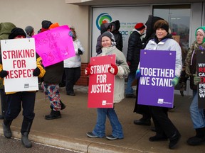 Personal support workers from the Service Employees International Union picket outside the Community Care Access Centre office in St. Thomas on Wednesday. The workers are part of a province-wide strike over wages and travel compensation.