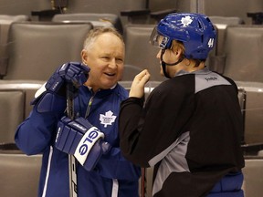 Maple Leafs head coach Randy Carlyle speaks to rookie Morgan Rielly at the end of practice at the Air Canada Centre in Toronto on Dec. 4, 2013. (MICHAEL PEAKE/Toronto Sun)