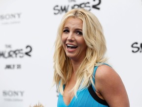 Singer Britney Spears poses at the premiere of "The Smurfs 2" at the Regency Village theatre in Los Angeles, California July 28, 2013.  REUTERS/Mario Anzuoni