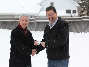 Gary Huizing from Cochrane Power (right) presenting Lions Club President Claude Bourassa with a cheque for $2,500 for the 2013 Lions Club Christmas Telethon. The donation came in after the Dec. 1 telethon.