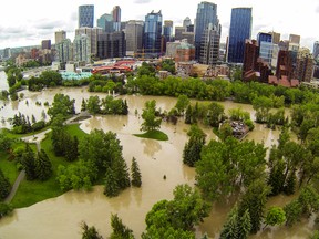 Bow River flood waters fill Prince's Island Park near downtown Calgary, Alta. on Friday, June 21, 2013. Massive flood waters throughout southern Alberta have heavily affected many thousands of residents. Lyle Aspinall/Calgary Sun/QMI Agency