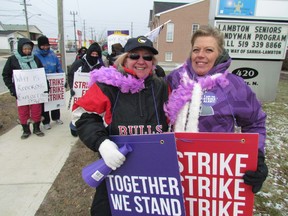 Cindy Robbins, left, and Victoria Peters are among approximately 100 personal support workers with Red Cross Care Partners on strike in Sarnia. The province wide strike by some 4,500 workers began Tuesday after they rejected a tentative agreement with the for-profit home care provider. PAUL MORDEN/ THE OBSERVER / QMI AGENCY