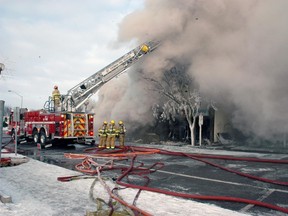 A thick pall of smoke covered much of the city Thursday as firefighters dealt with a major blaze that destroyed three businesses including a methadone clinic. 
Ian McCallum/Times-Journal