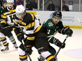 Kingston Frontenacs' Henri Ikonen and London Knights' Owen MacDonald battle for the puck during OHL action at the Rogers K-Rock Centre on  Nov. 15. Ikonen and teammate Mikko Vainonen will attend Finland's national junior team tryout camp next week. (Ian MacAlpine/The Whig-Standard)