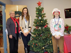 VON Middlesex Elgin volunteers Ruth Cochrane and Mary Crouch flank local coordinator of volunteers Dana Bell during the organization’s annual Open House Dec. 11th. VON uses the event to thank the their over 600 volunteers for their time and dedication.
JACOB ROBINSON/AGE DISPATCH/QMI AGENCY