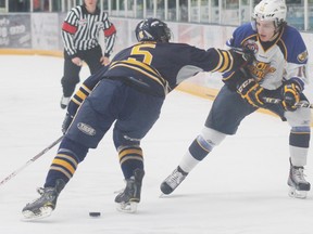 Kevin Miller (white jersey) who grew up playing minor hockey in Stony Plain and now skates for the Fort McMurray Oil Barons of the AJHL, has agreed to attend Ohio State on a hockey scholarship. - Robert Murray, Fort McMurray Today