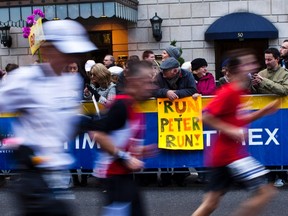 Runners make their way through the borough of Manhattan during the New York City Marathon in New York, November 3, 2013. REUTERS/Eduardo Munoz
