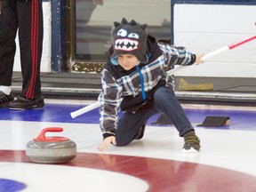When a curling rock weighs almost as much as you do it can be quite a challenge to slide it all the way down the ice but even so, this young man gave it his best shot at the junior bonspiel in Stony Plain on Dec. 7. - Gord Montgomery, Reporter/Examiner