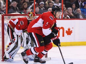 Ottawa Senators' Cody Ceci moves the puck up ice against the Buffalo Sabres' during his first NHL game at the Canadian Tire Centre in Ottawa on Thursday December 12, 2013. Errol McGihon/Ottawa Sun