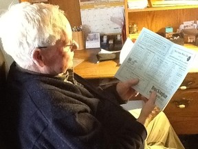 Blackhawks fan Raymond Richard reads over an old program from Maple Leaf Gardens (Submitted photo)