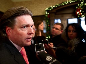 Jobs, Skills, Training and Labour minister Thomas Lukaszuk speaks with reporters after the swearing in of Premier Alison Redford's new cabinet at Government House in Edmonton, Alta., on Friday, Dec. 13, 2013. Ian Kucerak/Edmonton Sun/QMI Agency