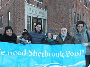 Friends of Sherbrook Pool president Marianne Cerilli (left) and Coun. Harvey Smith (second from right), along with swimmer Abriham Mohamed, and board members Will Tarleton, Jessica Dressler and Matt Austman (from left) let their feelings be known outside the pool on Fri., Dec. 13, 2013. (Kevin King/Winnipeg Sun)