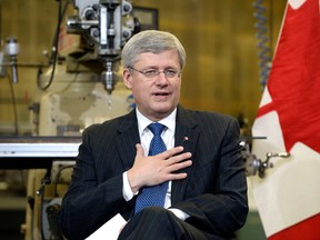 Canada's Prime Minister Stephen Harper is pictured at a pre-budget consultation at The Canadian Plastics Group in Newmarket, Nov. 28. Harper met with business representatives from the GTA in a roundtable discussion to launch a series of events across the country. 
REUTERS/Aaron Harris/QMI Agency