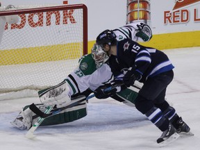 Winnipeg Jets forward Matt Halischuk scores past Dallas Stars goaltender Kari Lehtonen during first-period NHL action at MTS Centre in Winnipeg, Man. on Sat., Dec. 14, 2013. Kevin King/Winnipeg Sun/QMI Agency