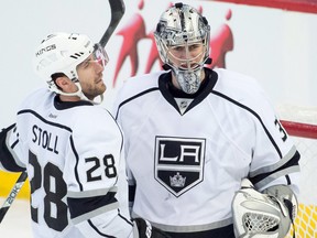 Los Angeles Kings center Jarret Stoll (28) congratulates goalie Martin Jone (31) following their win against the Ottawa Senators at the Canadian Tire Centre. The Kings defeated the Senators 5-2. 
Marc DesRosiers/USA Today