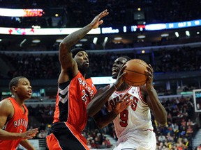 Chicago Bulls small forward Luol Deng is defended by Toronto Raptors small forward John Salmons (25) during the first quarter at the  United Center on Dec. 14. (David Banks-USA TODAY Sports)