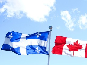 Canadian Flag and Quebec Flag are seen over looking the Ottawa River from the Civilization Museum behind Parliament Hill in Gatineau Sept 19, 2012.  (ANDRE FORGET/QMI AGENCY)