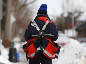 Canada's postal service will phase out urban home delivery within five years. (REUTERS/Chris Wattie)