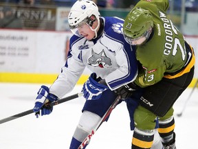 North Bay Battalion Barclay Goodrow, and Sudbury Wolves Ray Huether fight for the puck during OHL action from the Sudbury Community Arena on Sunday December 15/2013.
Gino Donato/The Sudbury Star/QMI Agency