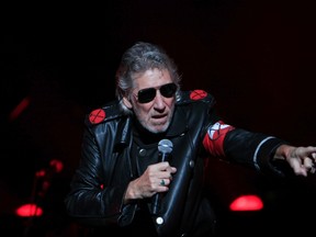 Former Pink Floyd co-founder and bass guitarist Roger Waters performs during "The Wall" tour live concert in Bucharest August 28, 2013. (REUTERS/Radu Sigheti)
