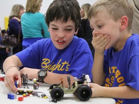 Bright's Grove students James Hall, 11, left, and Connor Freer, 6, played around during a break at the Sarnia Regional First Lego League Tournament Saturday, Dec. 14, 2013. (BARBARA SIMPSON, The Observer)
