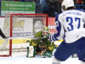 Gino Donato/The Sudbury Star
North Bay Battalion goalie Jake Smith keeps his eye on the puck on a shot from Sudbury Wolves Mathew Campagna during OHL action from the Sudbury Community Arena on Sunday.