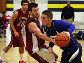 Ben Leeson/The Sudbury Star
College Notre Dame's Sebastien Dugas, right, drives toward the basket while St. Charles' Connor Chezzi defends during BAC Invitational senior boys basketball tournament final action at Bishop Alexander Carter on Saturday.