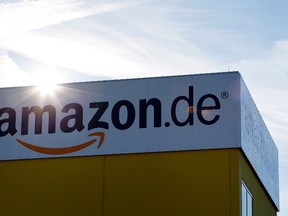 The sun reflects off Amazon's logistics centre in Graben near Augsburg Dec. 16, 2013. REUTERS/Michaela Rehle