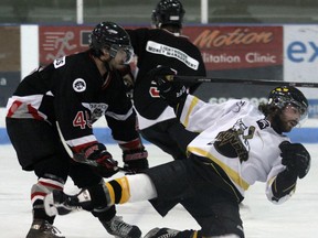 Tillsonburg Thunder Cody Chute (right) is cross checked to the ice by Goderich Pirate Steve Kewley Saturday inside the Kinsmen/Memorial Arena. A two-minute minor was assessed on the play. Jeff Tribe/Tillsonburg News