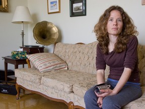 Anti-wind turbine activist Esther Wrightman, shown in this file photo at her home, is being sued by NextEra Energy. The company says it will donate any judgement to United Way Canada. That agency said recently it would accept the money, disappointing Wrightman and her supporters. (QMI Agency)