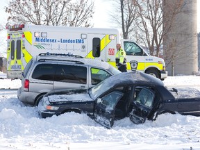 The driver of the a car was taken to hospital after colliding with a van at the intersection of Denfield Road and 12 Mile Road north of London, Ont. on Monday December 16, 2013. (DEREK RUTTAN, The London Free Press)