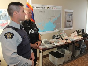 Police display some of the drugs, cash and personal property seized following a joint law enforcement operation that targeted an international drug smuggling network.
Michael Lea The Whig-Standard