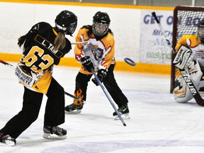 Lauren Tam of the Mitchell U14A ringette team fires a shot on the Waterloo net during action Dec. 5, a 6-2 win. ANDY BADER/MITCHELL ADVOCATE