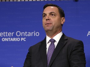 Ontario PC Leader Tim Hudak holds a press conference December 10, 2013. (Craig Robertson/Toronto Sun)