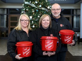 Salvation Army staff (from left) Brita Owen, financial co-ordinator, Bonita McCourt, director of community and family services and Ed Peterson, assistant kettle co-ordinator with some kettles they hope to fill with cash over the next week at the Kingston Citadel on Monday.
IAN MACALPINE/KINGSTON WHIG-STANDARD/QMI AGENCY