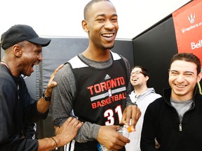Raptors' Terrence Ross shares a laugh with head coach Dwane Casey during Monday's practice at the ACC. (Stan Behal, Toronto Sun)