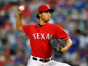 Texas Rangers starter Yu Darvish pitches against the Houston Astros during MLB play in Arlington, Tex., September 24, 2013. (REUTERS/Mike Stone)