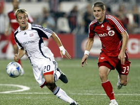 Former TFC midfielder Carl Robinson (right) was named coach of the Vancouver Whitecaps on Monday. (SUN files)