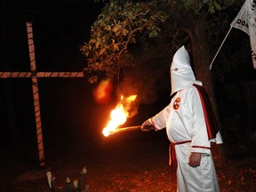 David Webster of the Ku Klux Klan (KKK) begins a cross lighting ceremony at a Klansman's home in Warrenville, S.C., in this October 23, 2010 file photo. (REUTERS/Rainier Ehrhardt)