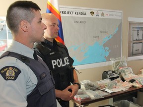 Police display some of the drugs, cash and personal property seized following a joint law enforcement operation that targeted an international drug smuggling network in Kingston, ON Monday, Dec. 16, 2013 - MICHAEL LEA/The Whig-Standard