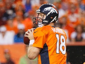 Denver Broncos quarterback Peyton Manning looks to pass against the Baltimore Ravens during the first quarter in their NFL football game in Denver, Colorado September 5, 2013. (REUTERS)