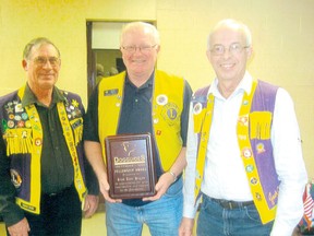 The Lucknow Lions Club's Tom Hogan was presented with the Dog Guides Fellowship Award recently. L-R: Lions president Wayne Todd presented Hogan with the award, along with secretary Jack Cameron.