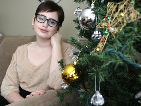 Danielle Taylor, 24, shares her cancer journey in her Bright's Grove home Thursday. Since being diagnosed with colon cancer in August, the York University student has undergone chemotherapy and radiation, as well as having her eggs harvested. She will go under the knife in January to have the tumour from her colon removed. (BARBARA SIMPSON, The Observer)