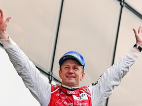 Audi R18 E-Tron Quattro Number 2 driver Allan McNish celebrates after winning the Le Mans 24-hour earlier this year. (REUTERS)